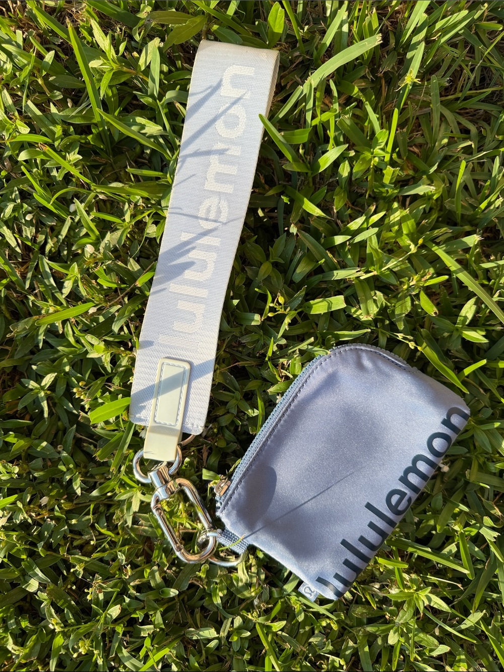 lululemon athletica blue wristlet pouch with branded strap